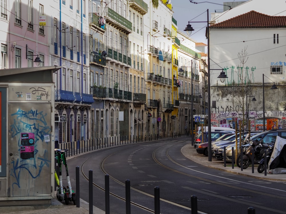 a city street with cars parked on the side of it