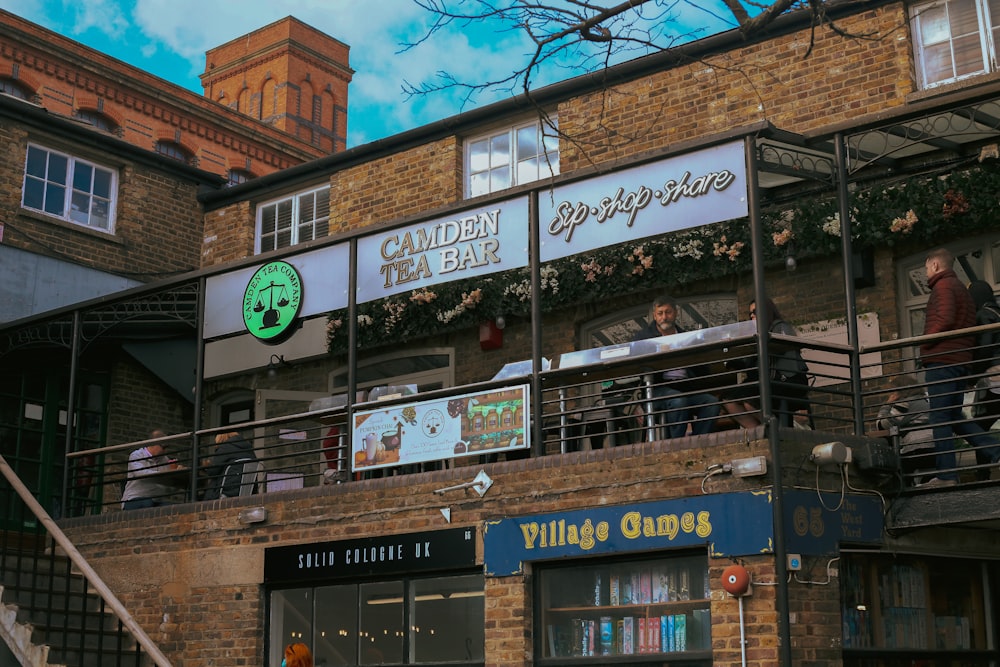 the outside of a building with a sign for a coffee shop