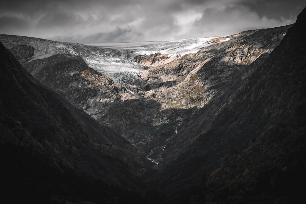 a black and white photo of a mountain range