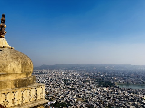 An intricate blueprint overlaying a rising city skyline symbolizing empire building.