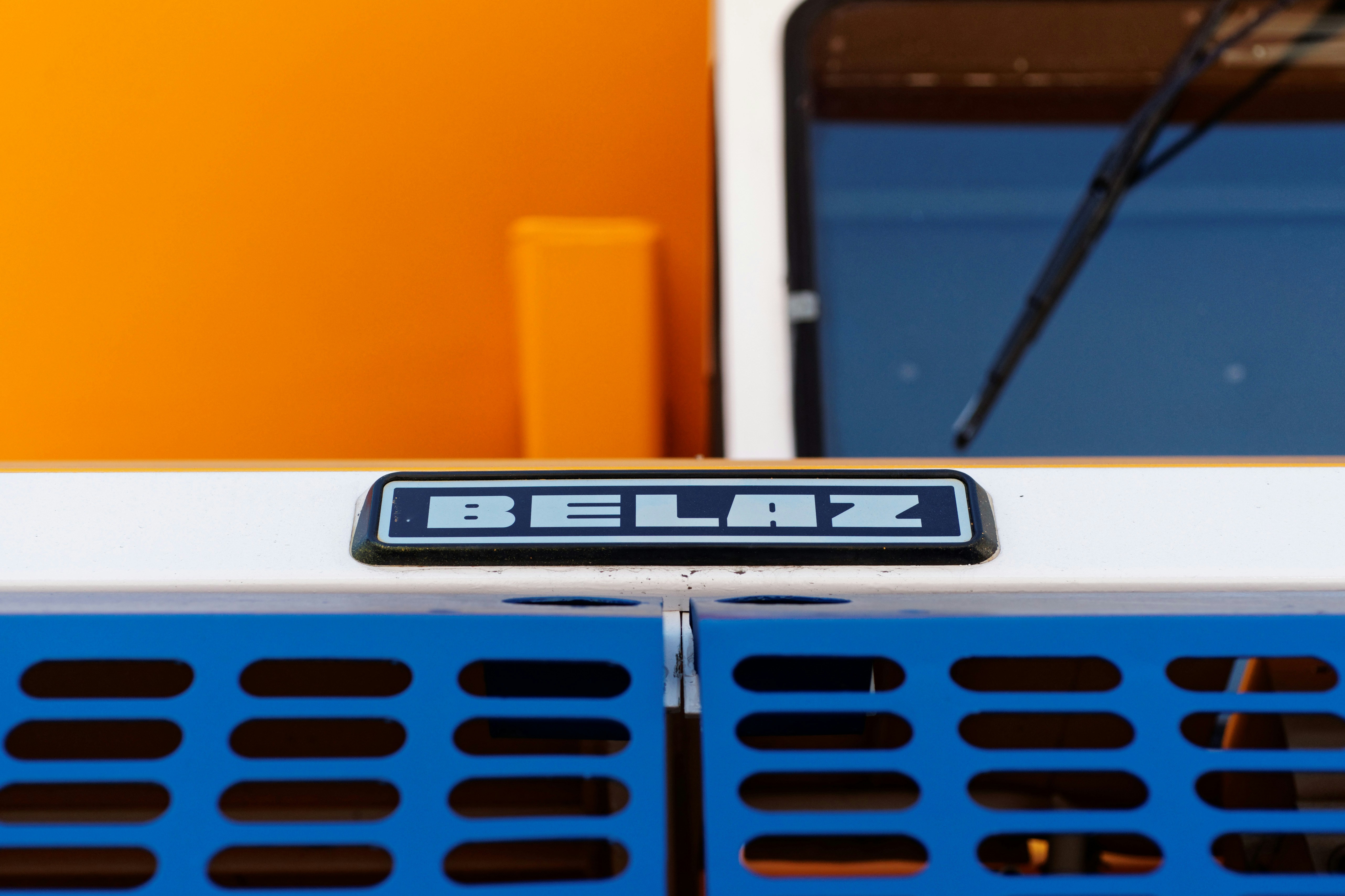 Closeup of an electric car dashboard showing battery state-of-charge and remaining driving range