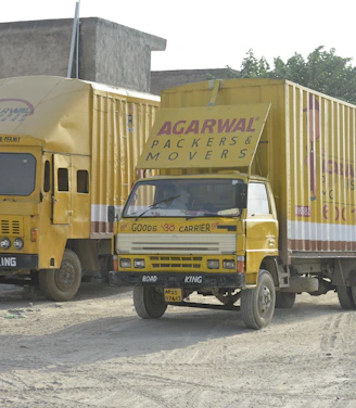 Professional movers carefully packing and loading furniture inside a moving truck in Saudi Arabia.