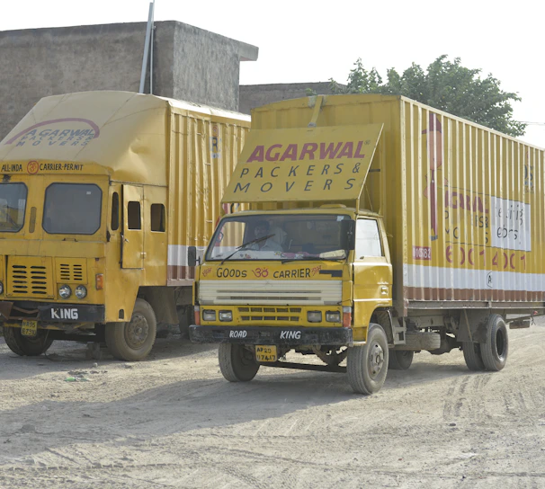 Professional movers carefully packing and loading furniture inside a moving truck in Saudi Arabia.