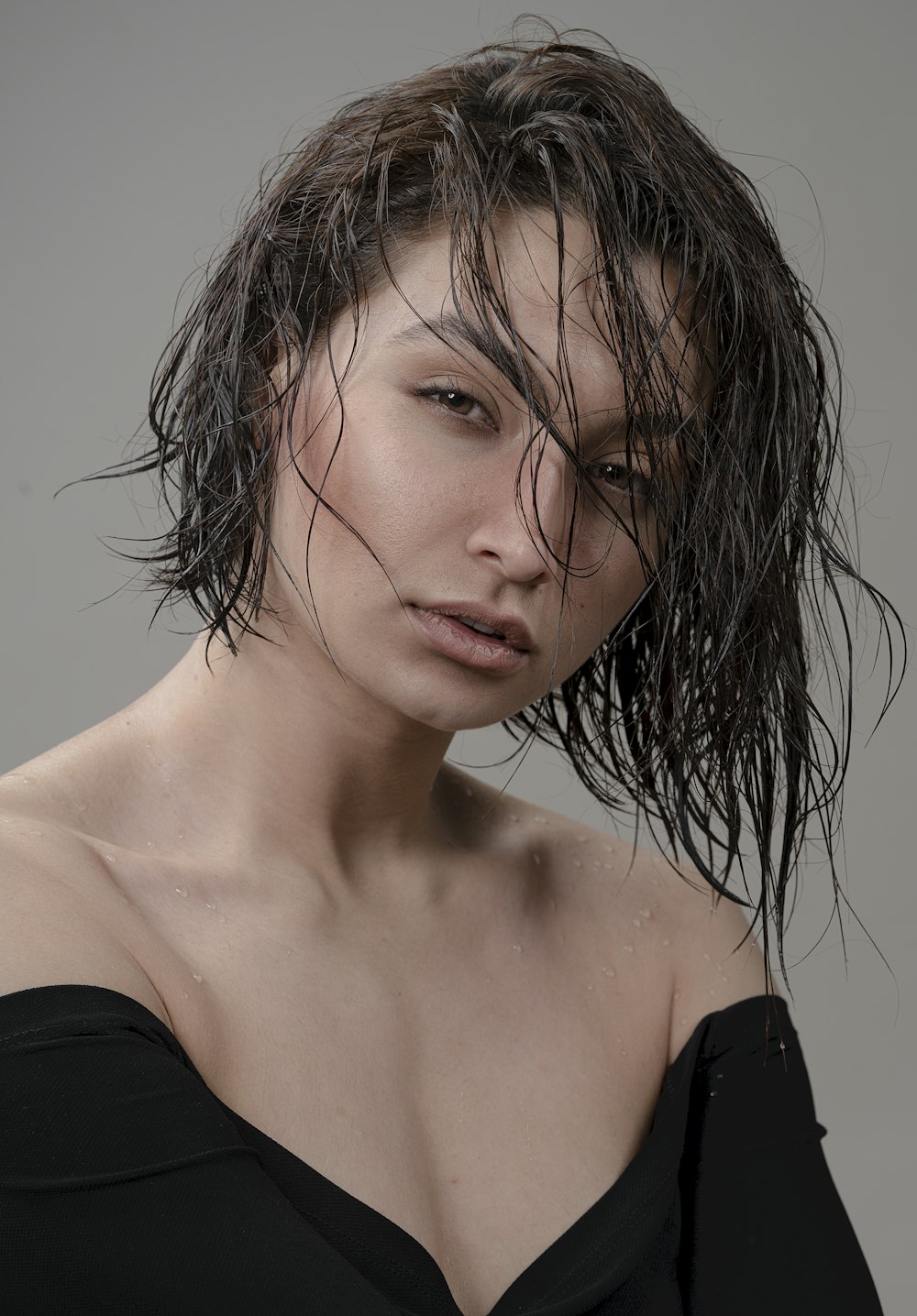 a woman with wet hair posing for a picture