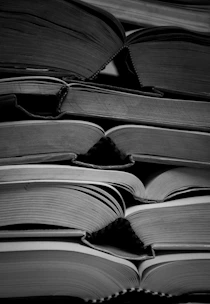 a stack of books sitting on top of each other