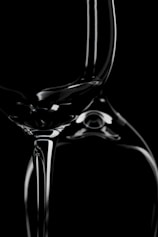 a black and white photo of a wine glass