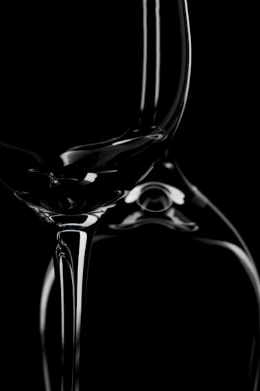a black and white photo of a wine glass