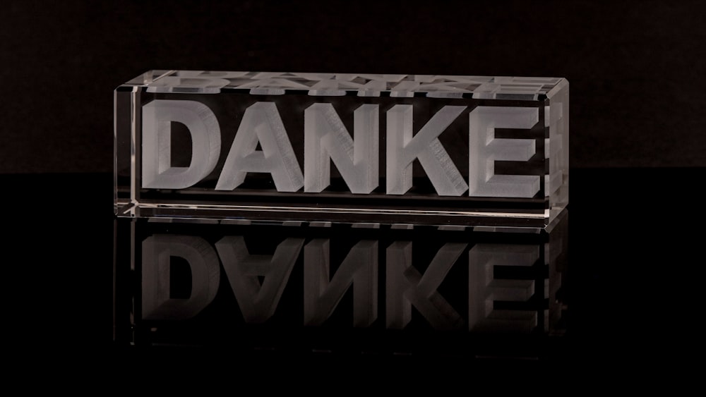 a glass block with the word danke on it