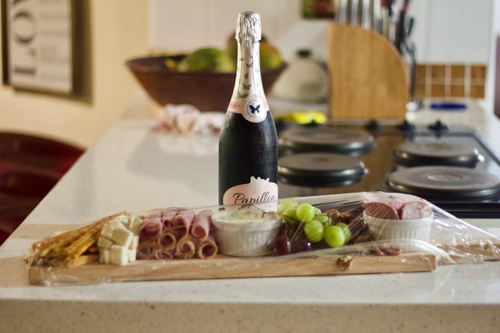 a bottle of wine sitting on top of a counter