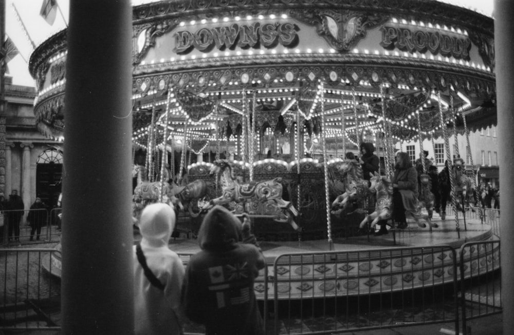 a merry go round in a black and white photo