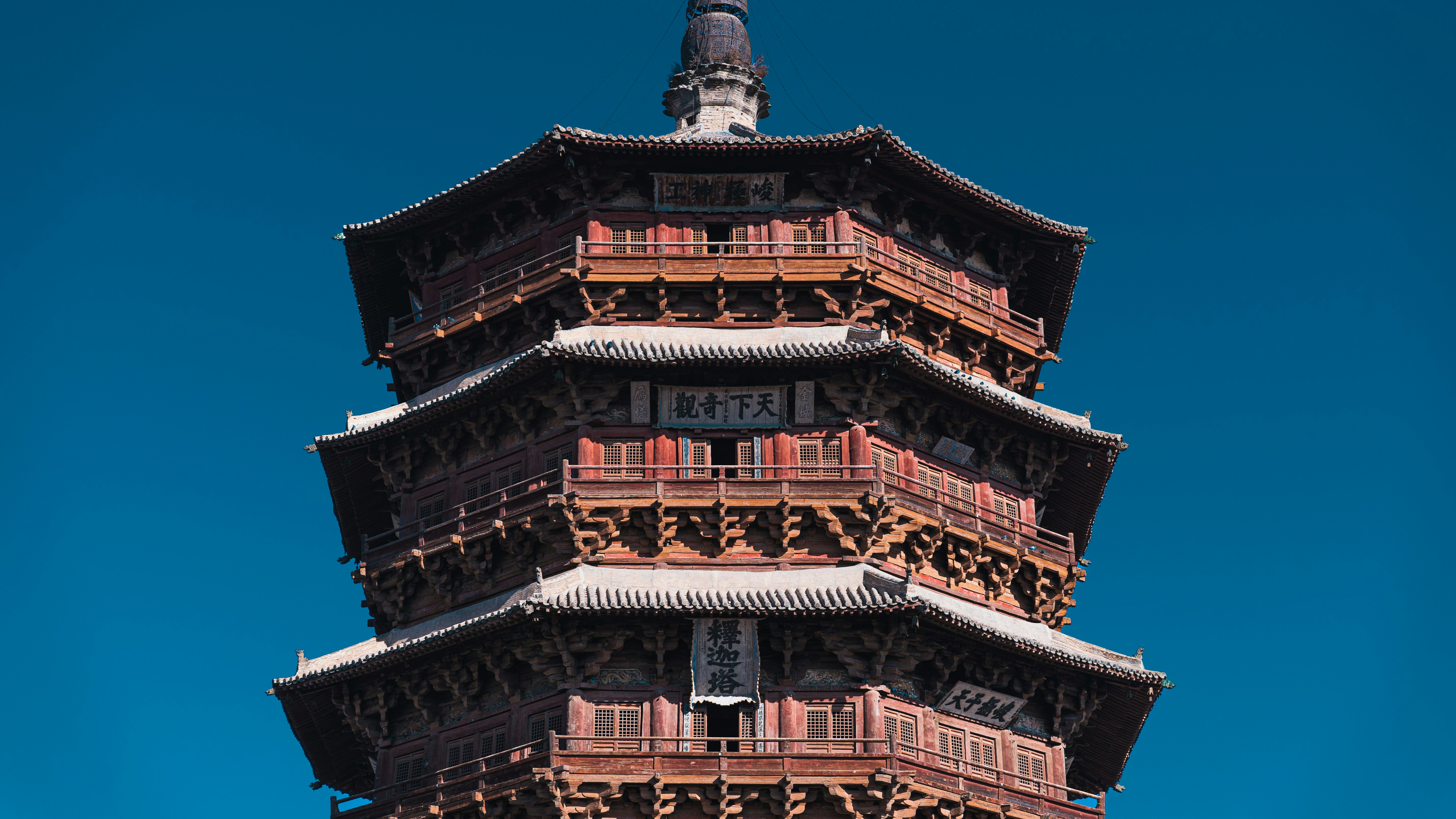 a large tall tower with a clock at the top of a building