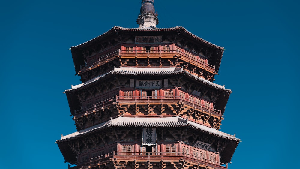 a large tall tower with a clock at the top of a building