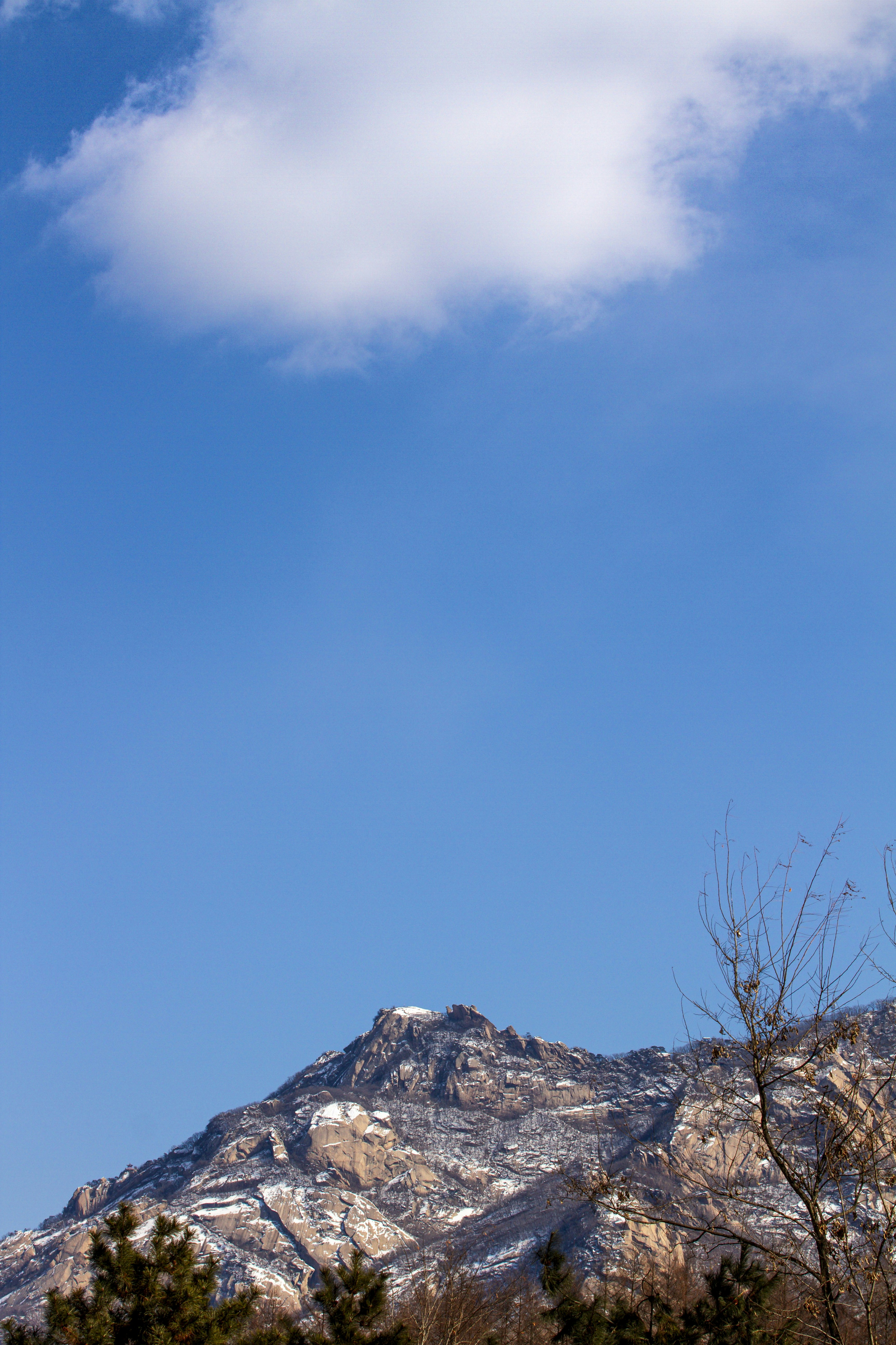 a view of a mountain with snow on it