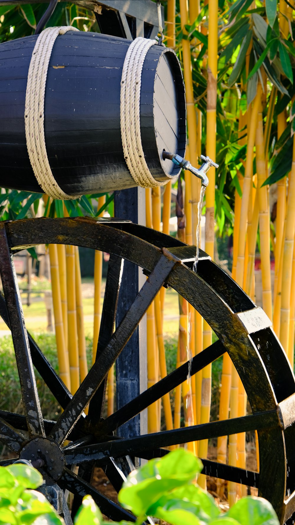 a wooden wagon with two barrels attached to it