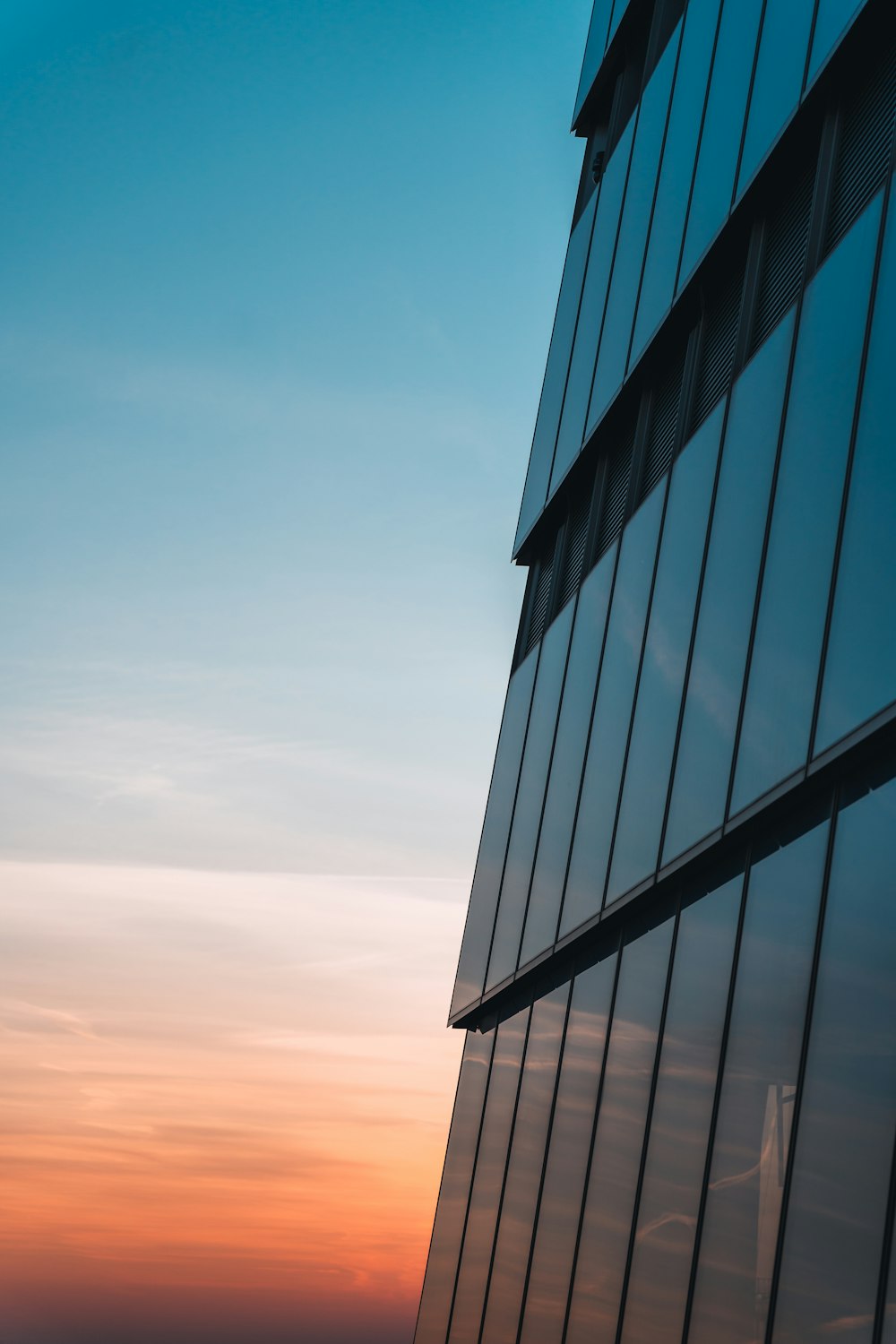 a very tall building with a sky in the background