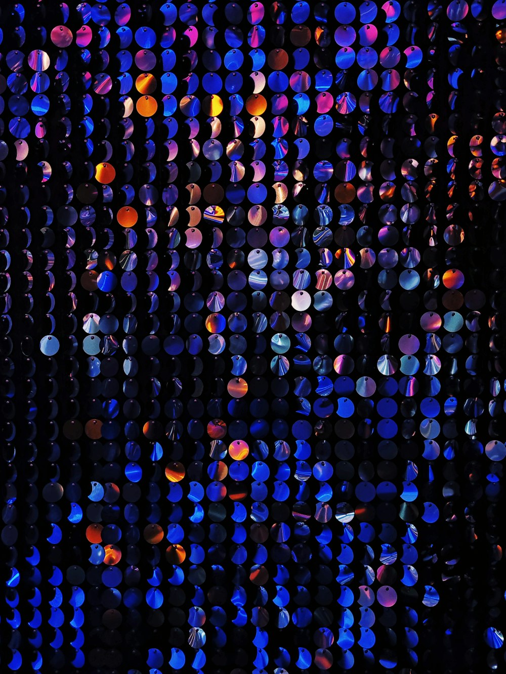 a black background with many different colored circles
