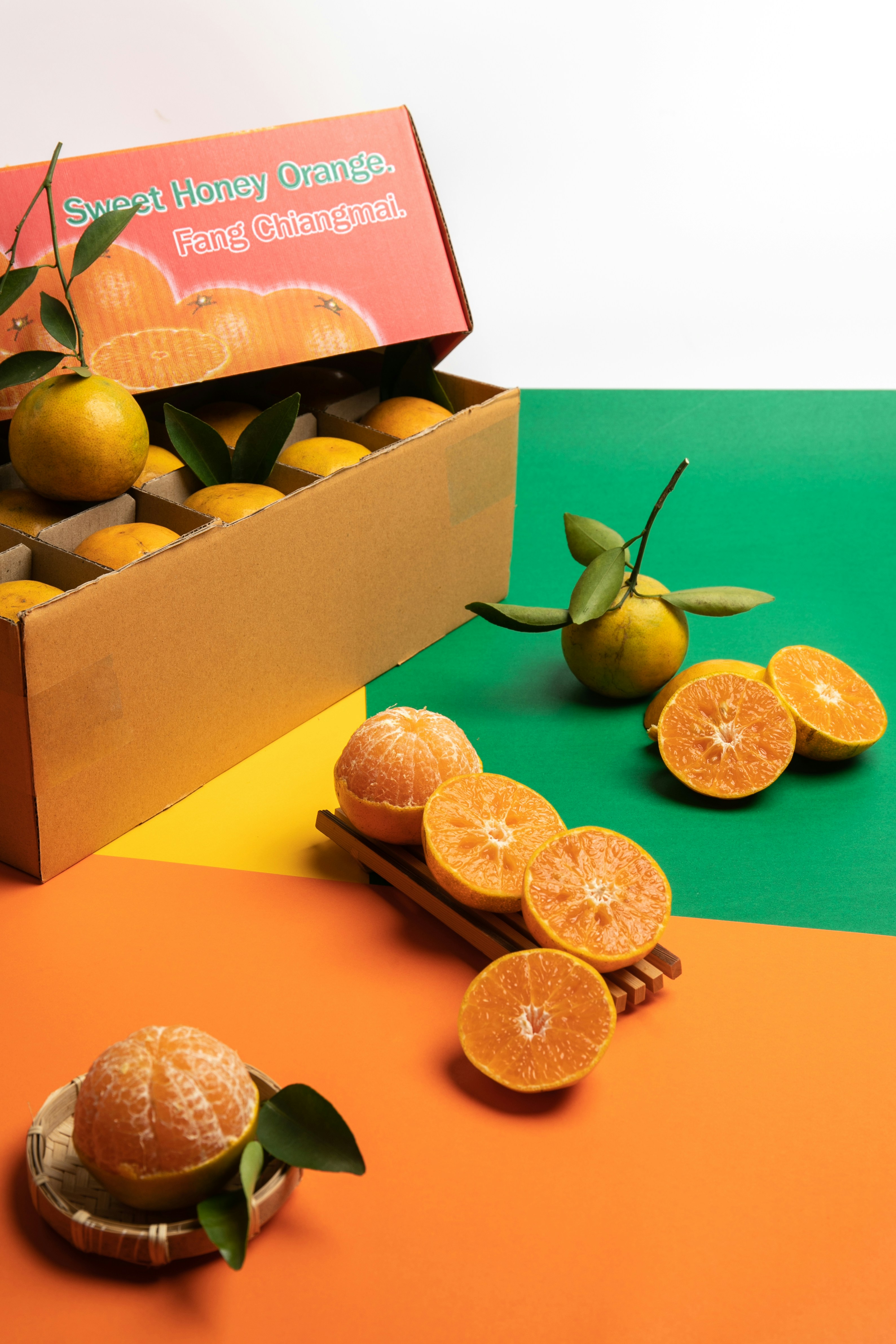 a box of oranges sitting on top of a table