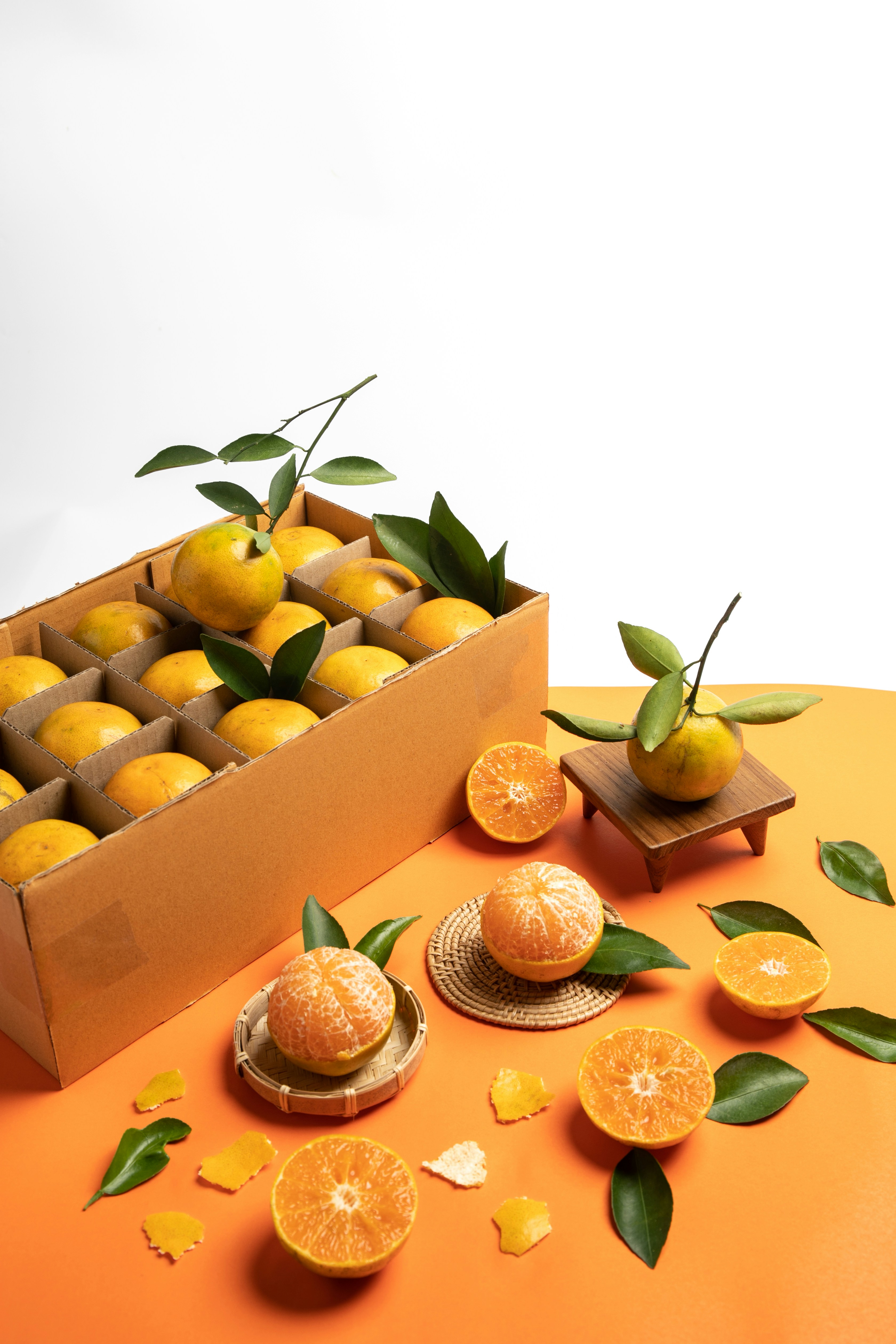 a box filled with oranges sitting on top of a table