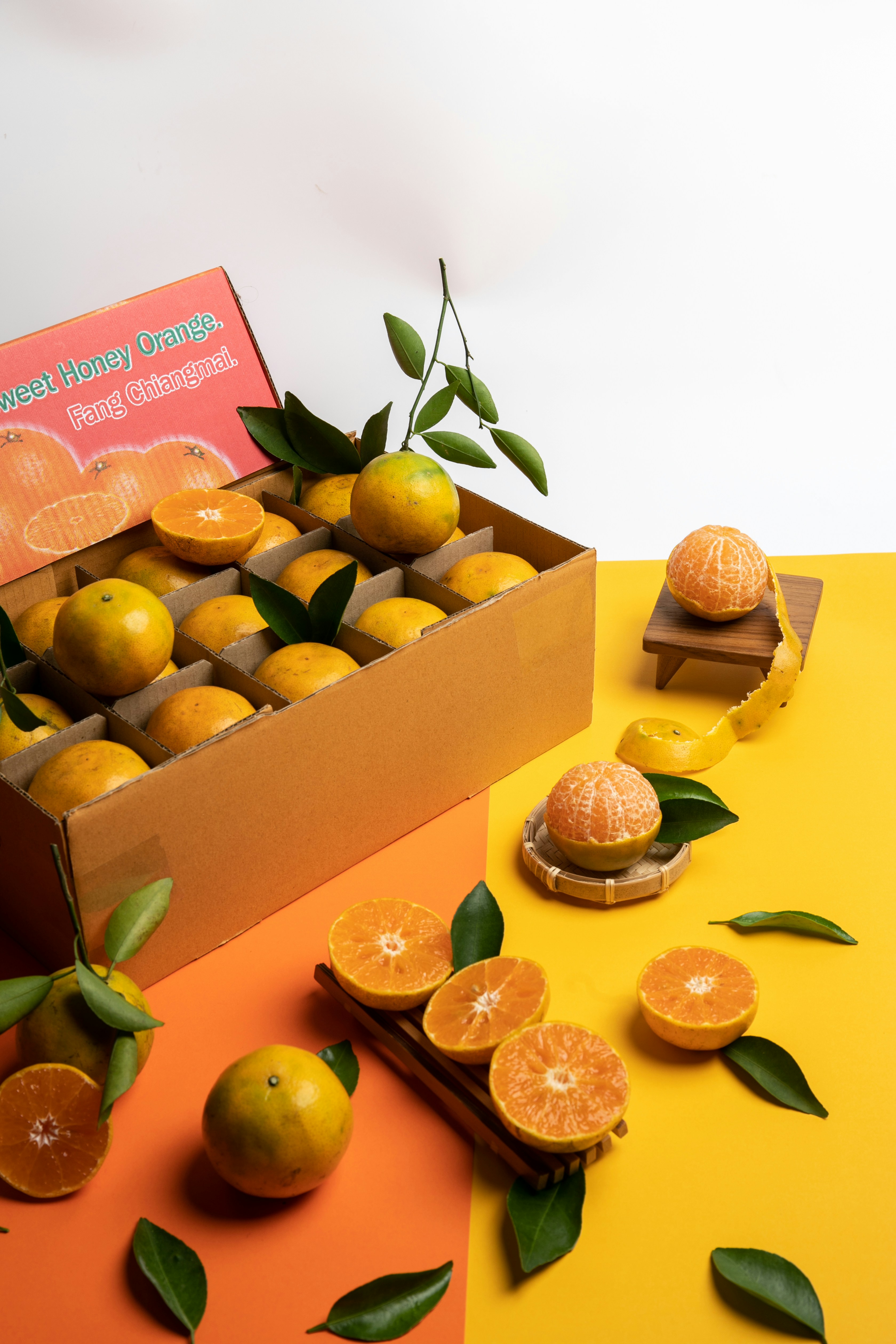 a box of oranges sitting on top of a table