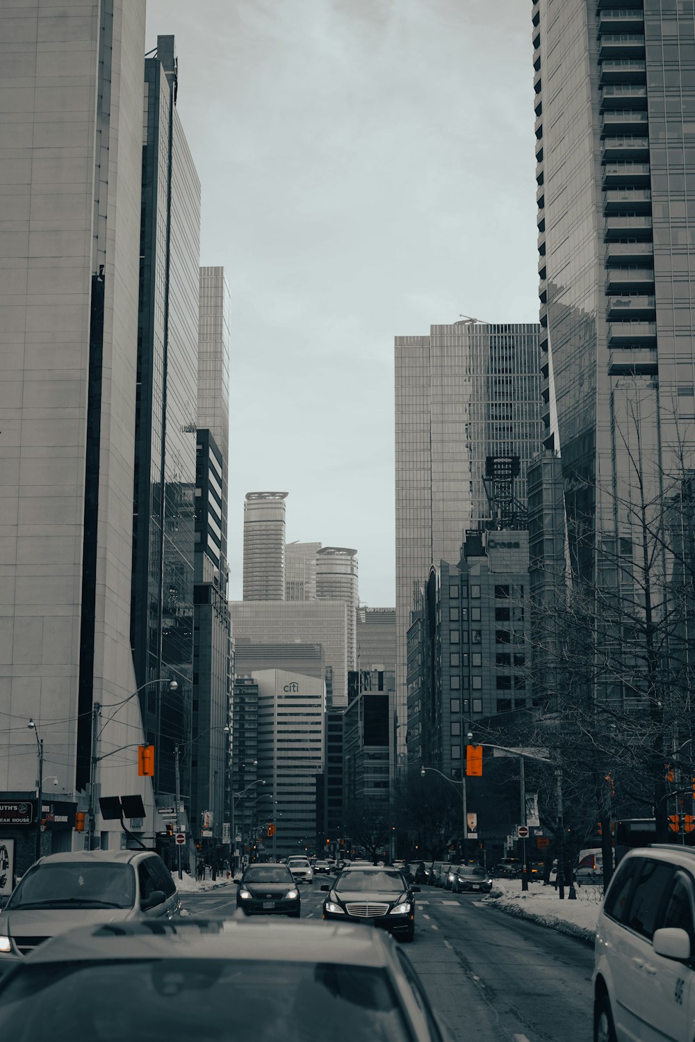 a city street filled with lots of tall buildings