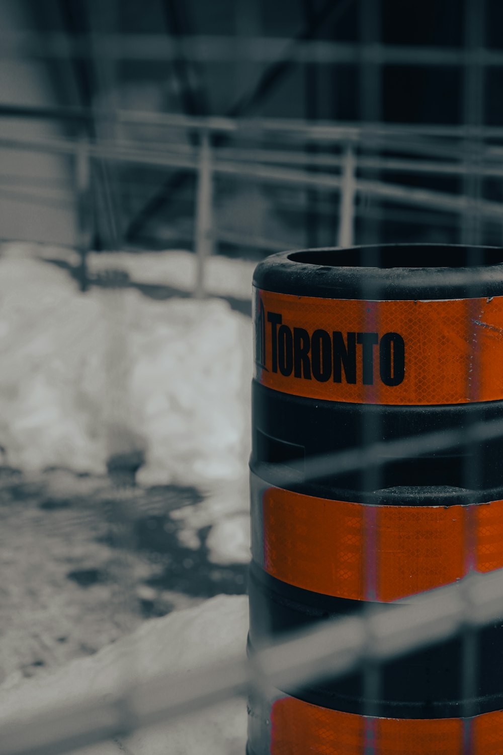 a close up of a street sign with snow in the background