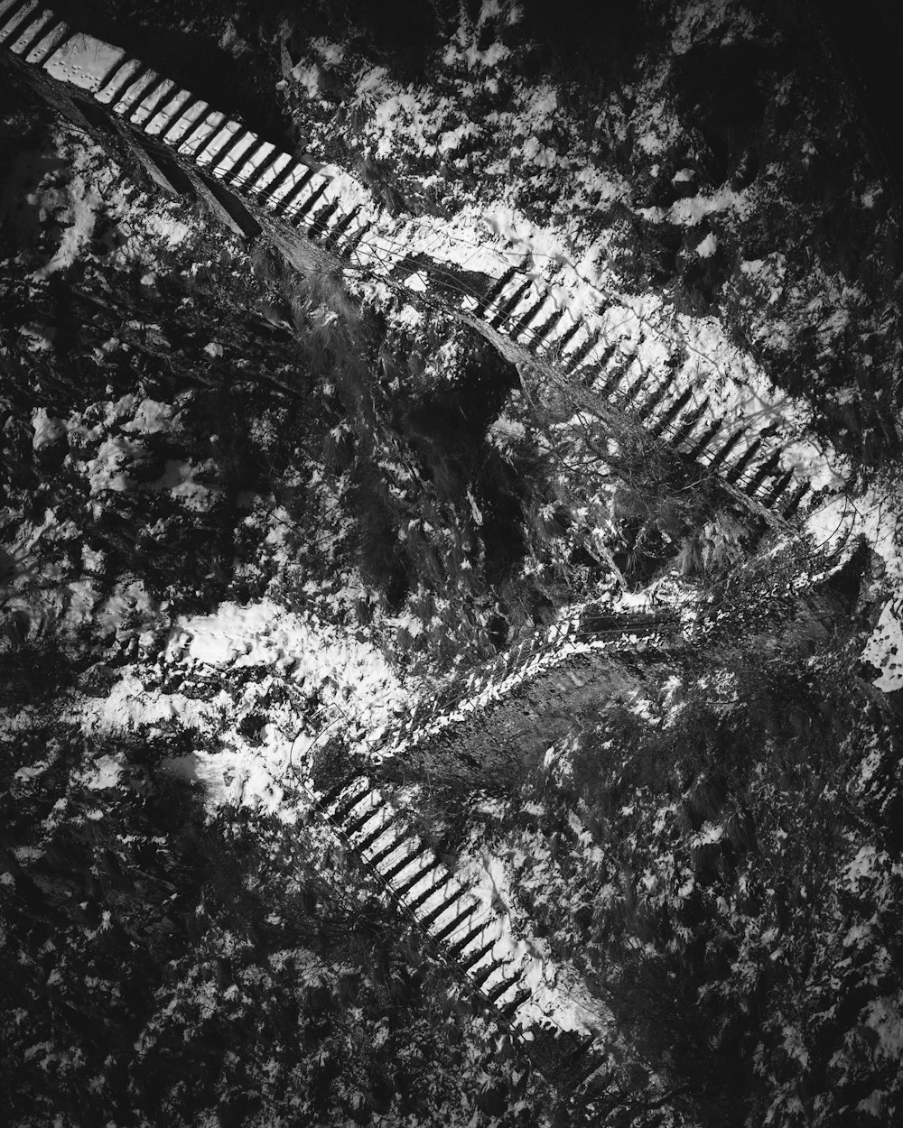 a black and white photo of a train track