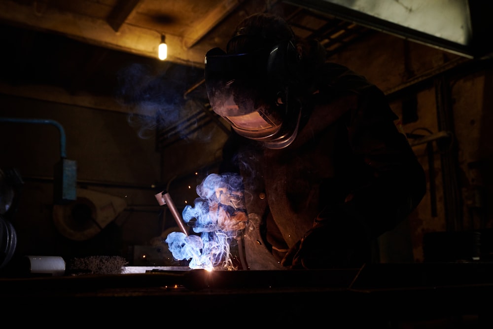 a person cooking in a dark room