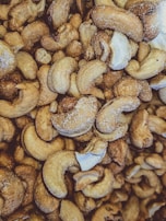 Processed cashew nuts displayed in clear packaging highlighting their freshness and quality.