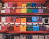 A vibrant display of various ice cream toppings and syrups.