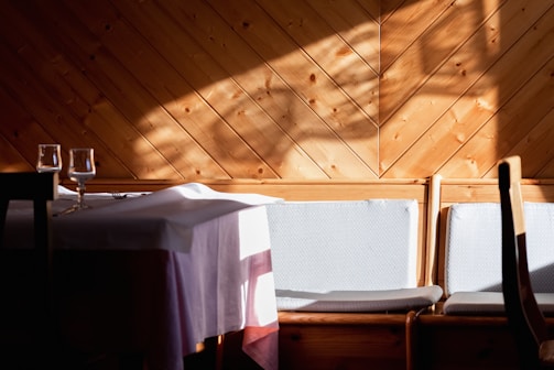 Newly installed hardwood flooring in a sunlit dining area.