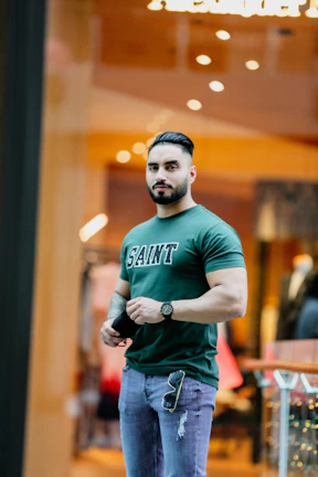 a man standing in front of a store window