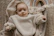 A beautifully arranged baby gift basket with cozy blankets and cute accessories.