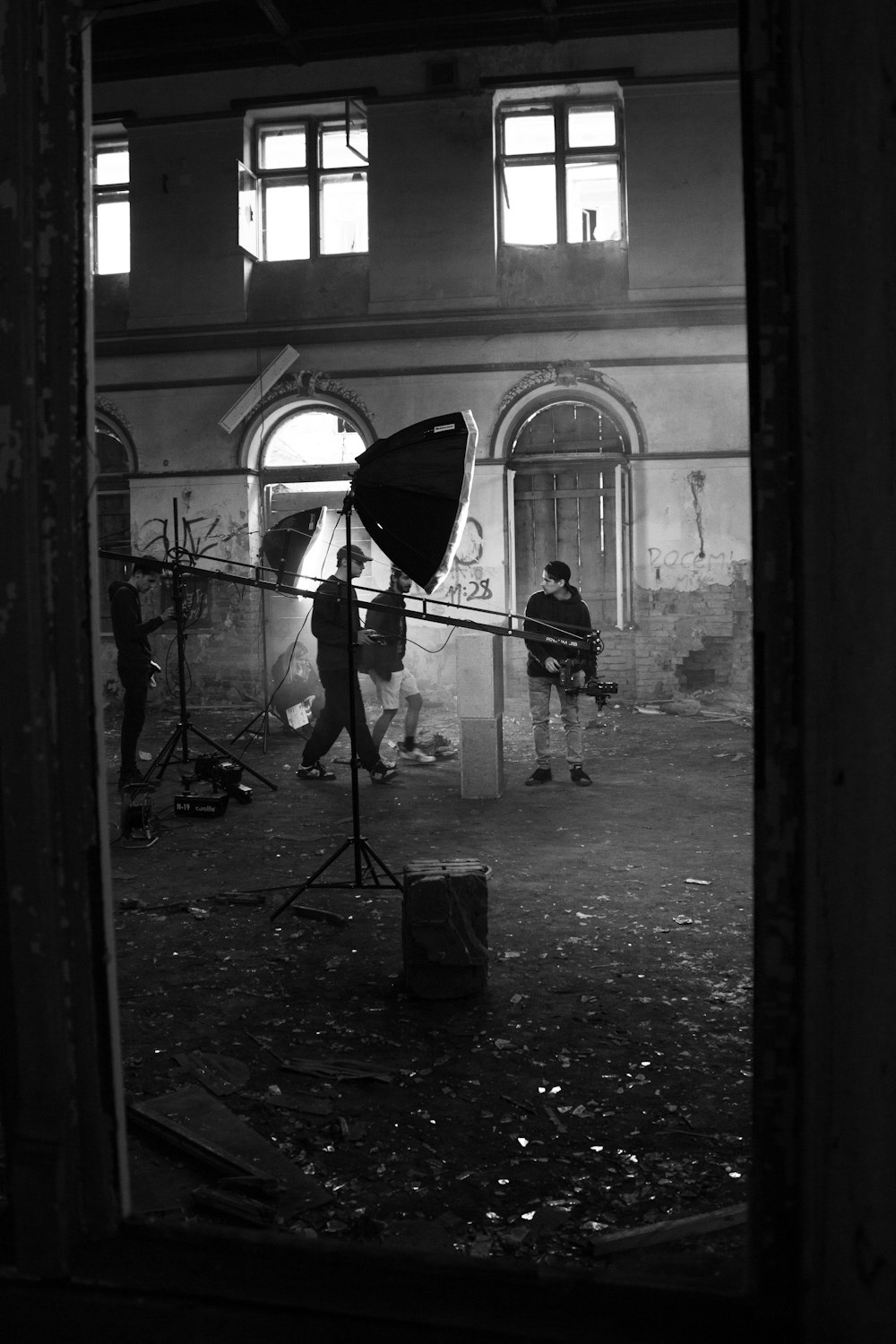 a black and white photo of people in a building