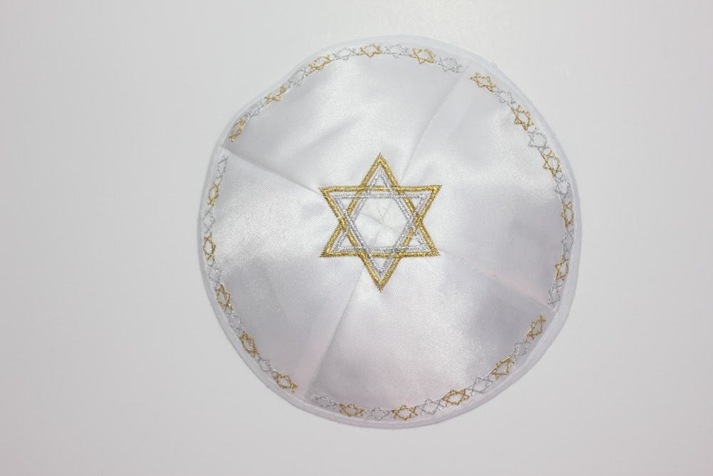 a white cloth with a gold star of david on it