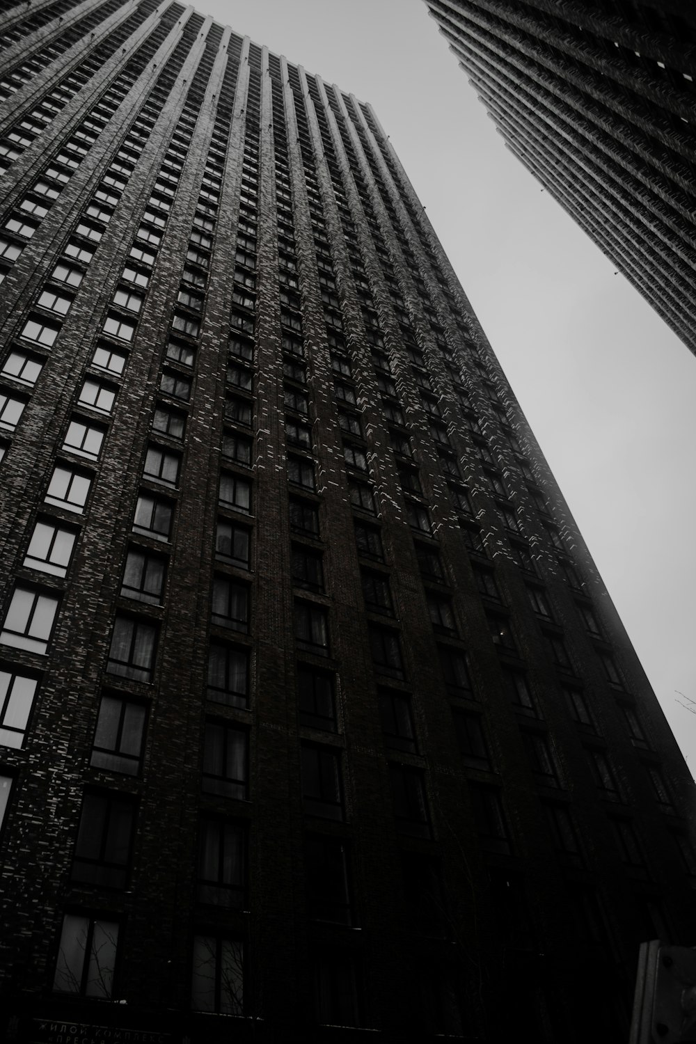 a black and white photo of a tall building