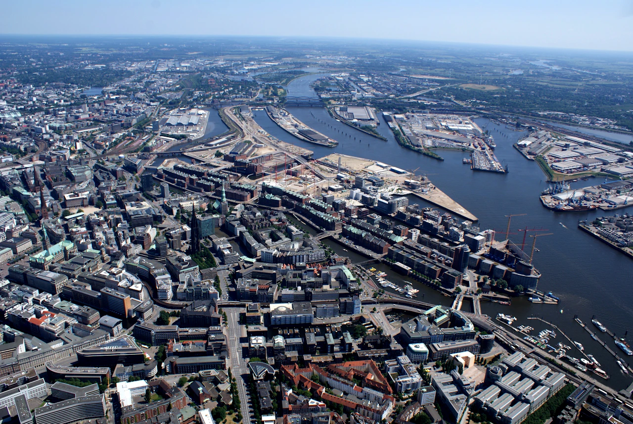 An aerial view of a city and its port on a winding river