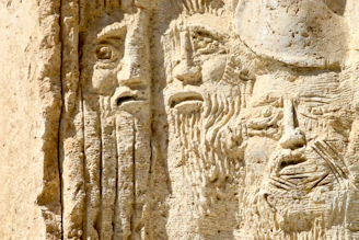 a close up of a carving on a wall