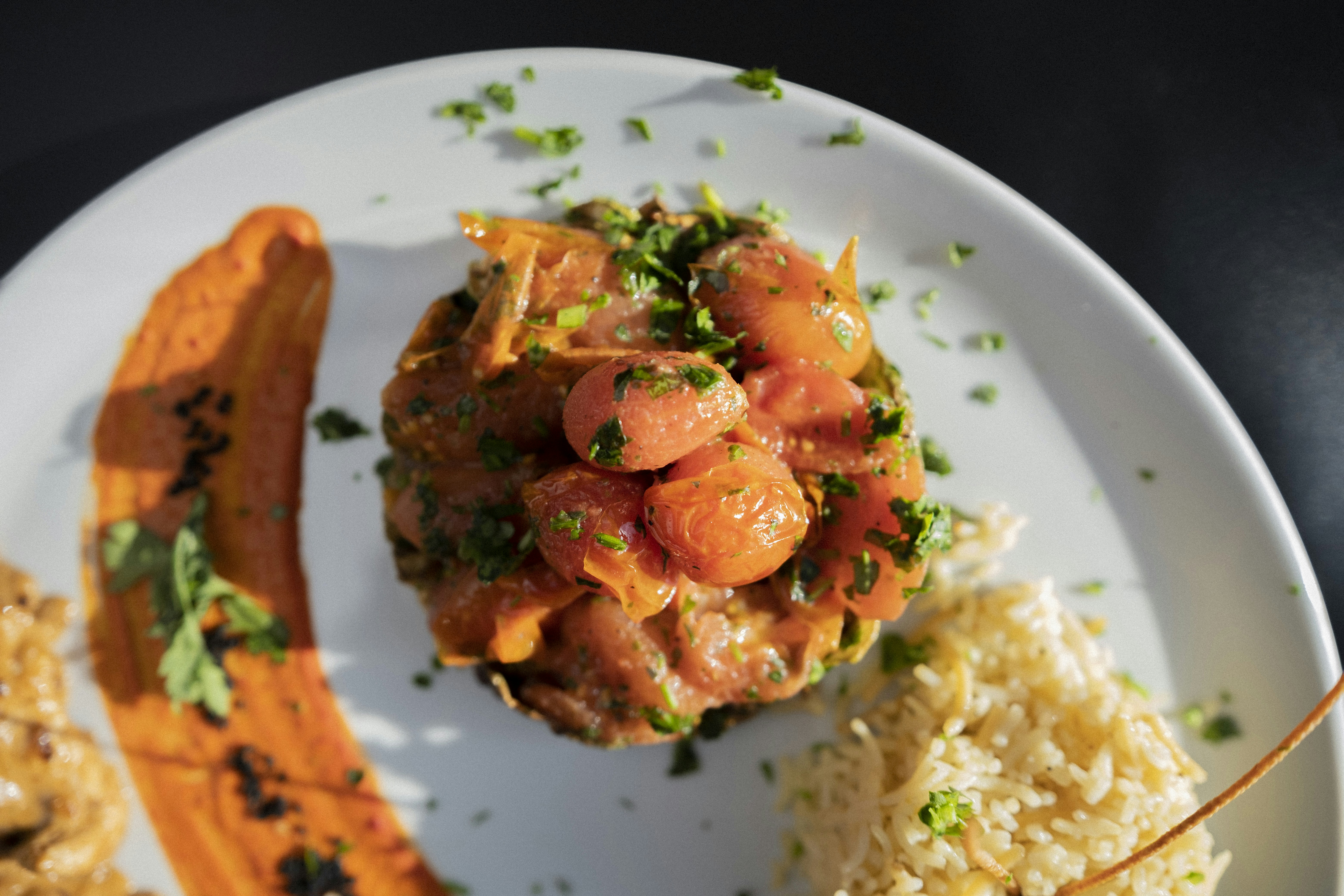 a white plate topped with rice and meat
