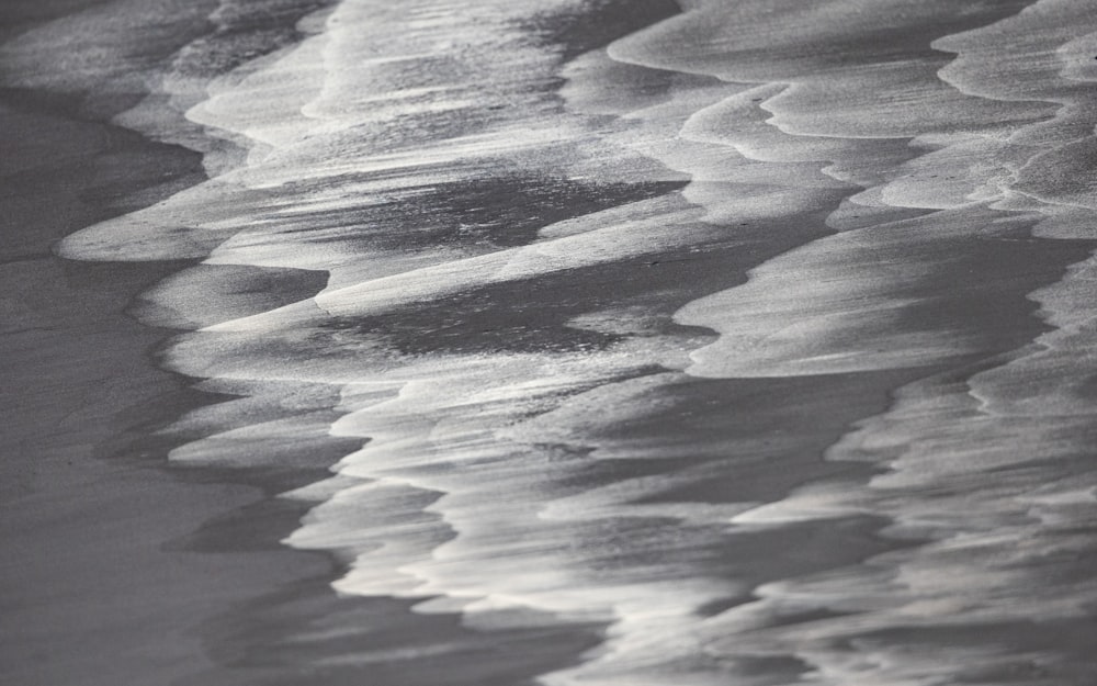 a black and white photo of the ocean waves