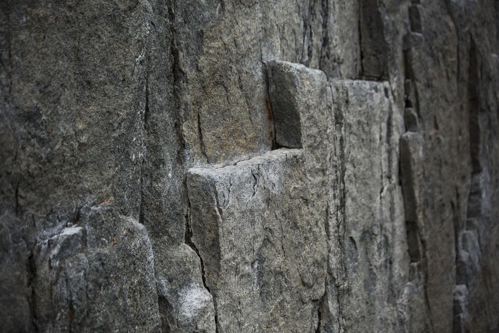 a close up of a wall made of rocks