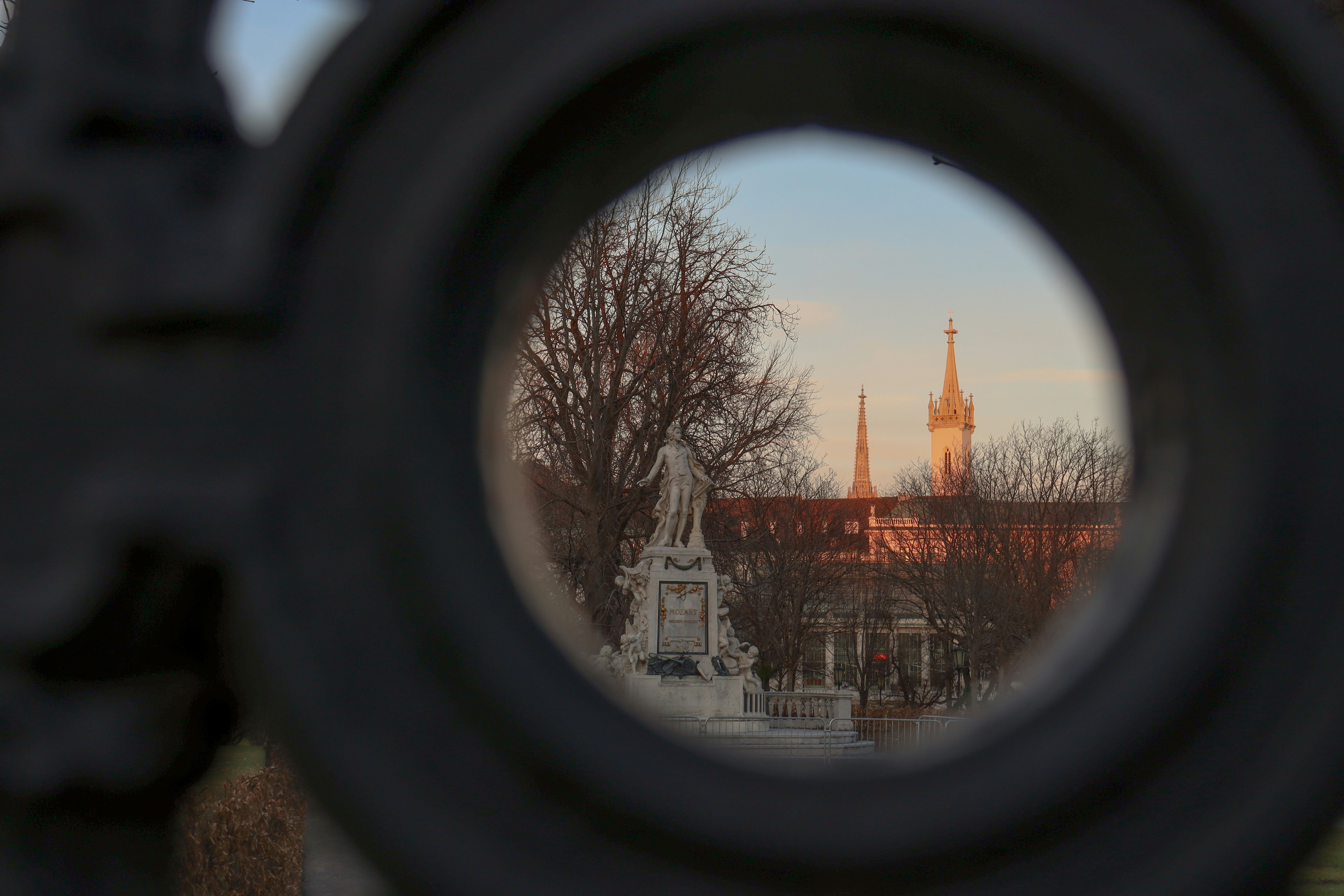 a view of a building through a round window