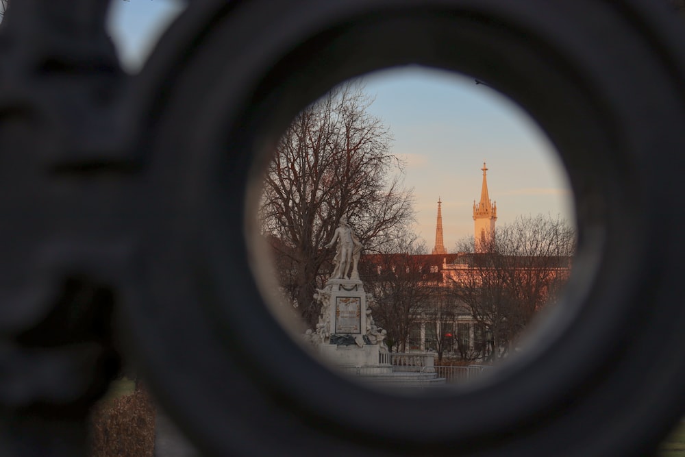 a view of a building through a round window