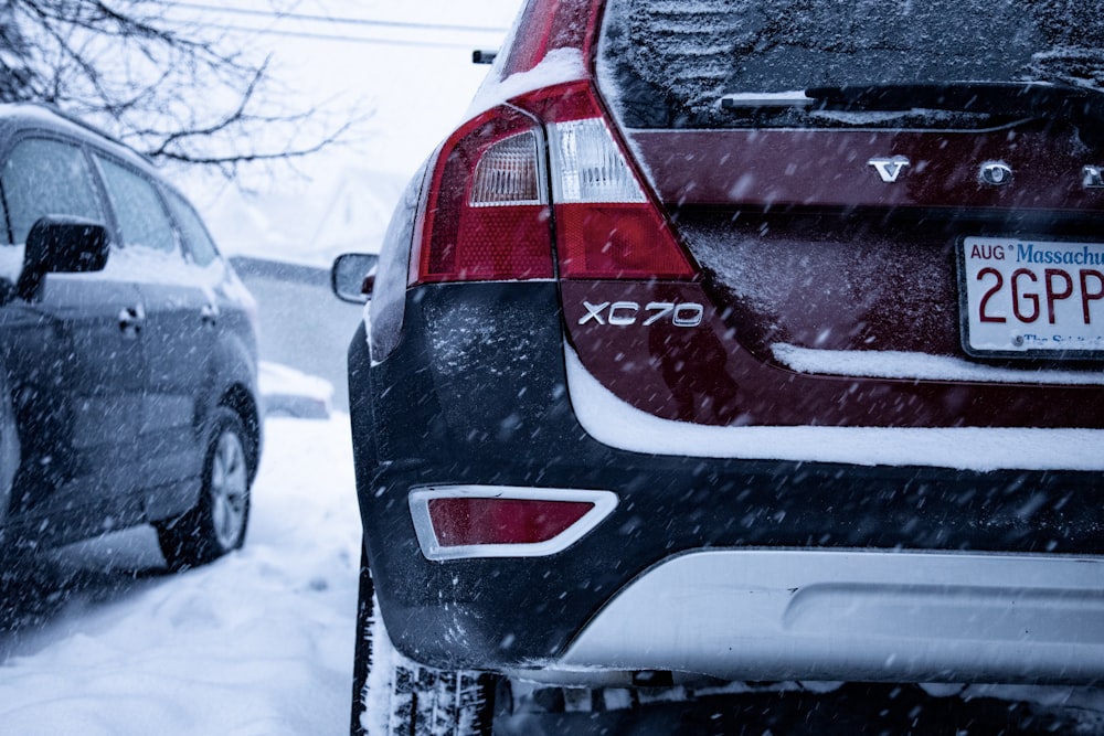 a couple of cars that are parked in the snow