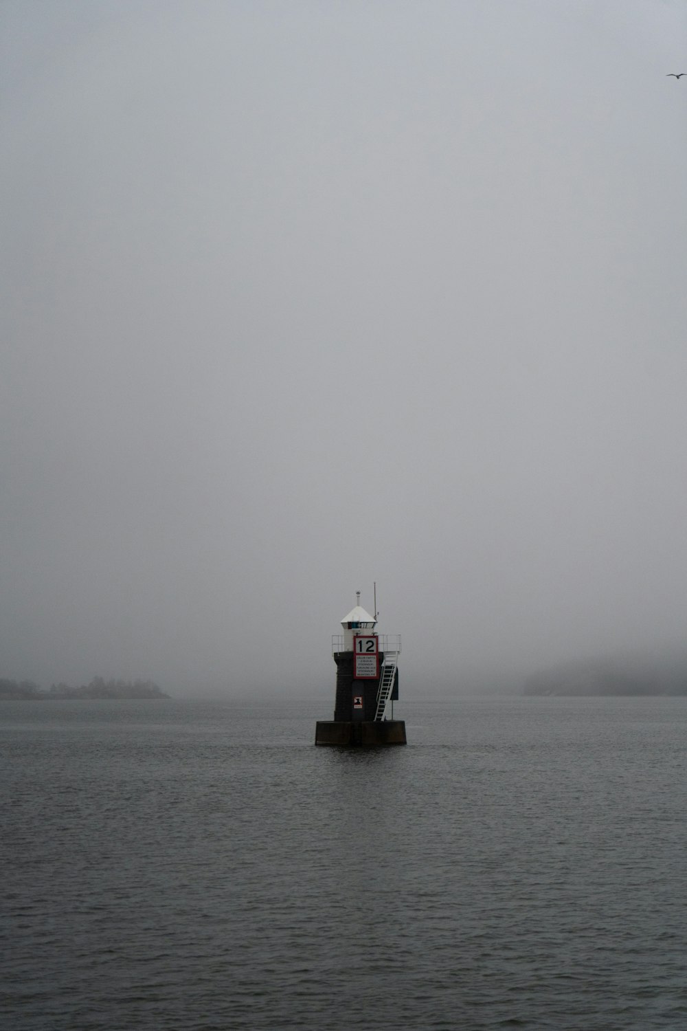 a boat floating on top of a large body of water