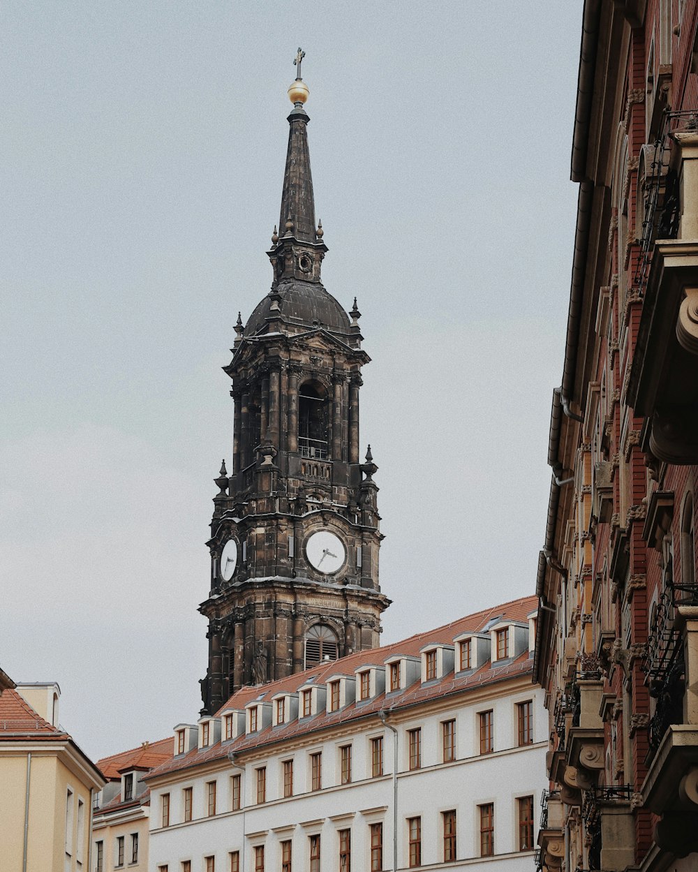 a tall clock tower towering over a city