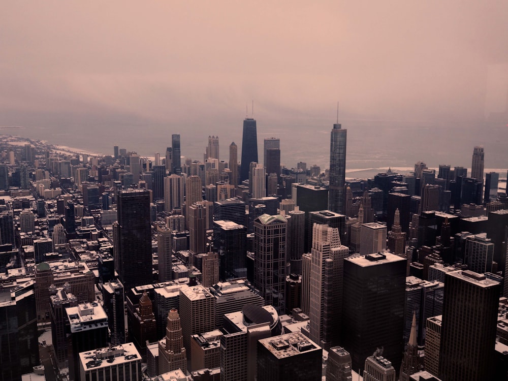 an aerial view of a city with tall buildings