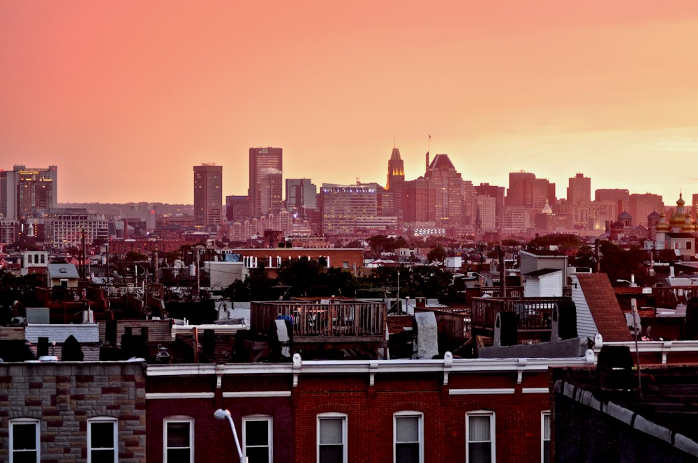 a view of a city skyline at sunset