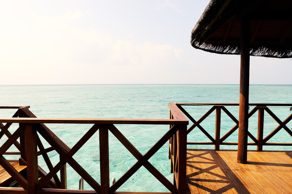 a view of the ocean from a wooden deck