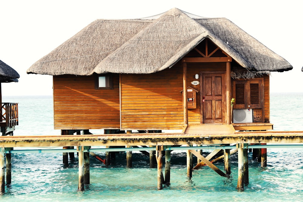 a wooden dock in front of a house