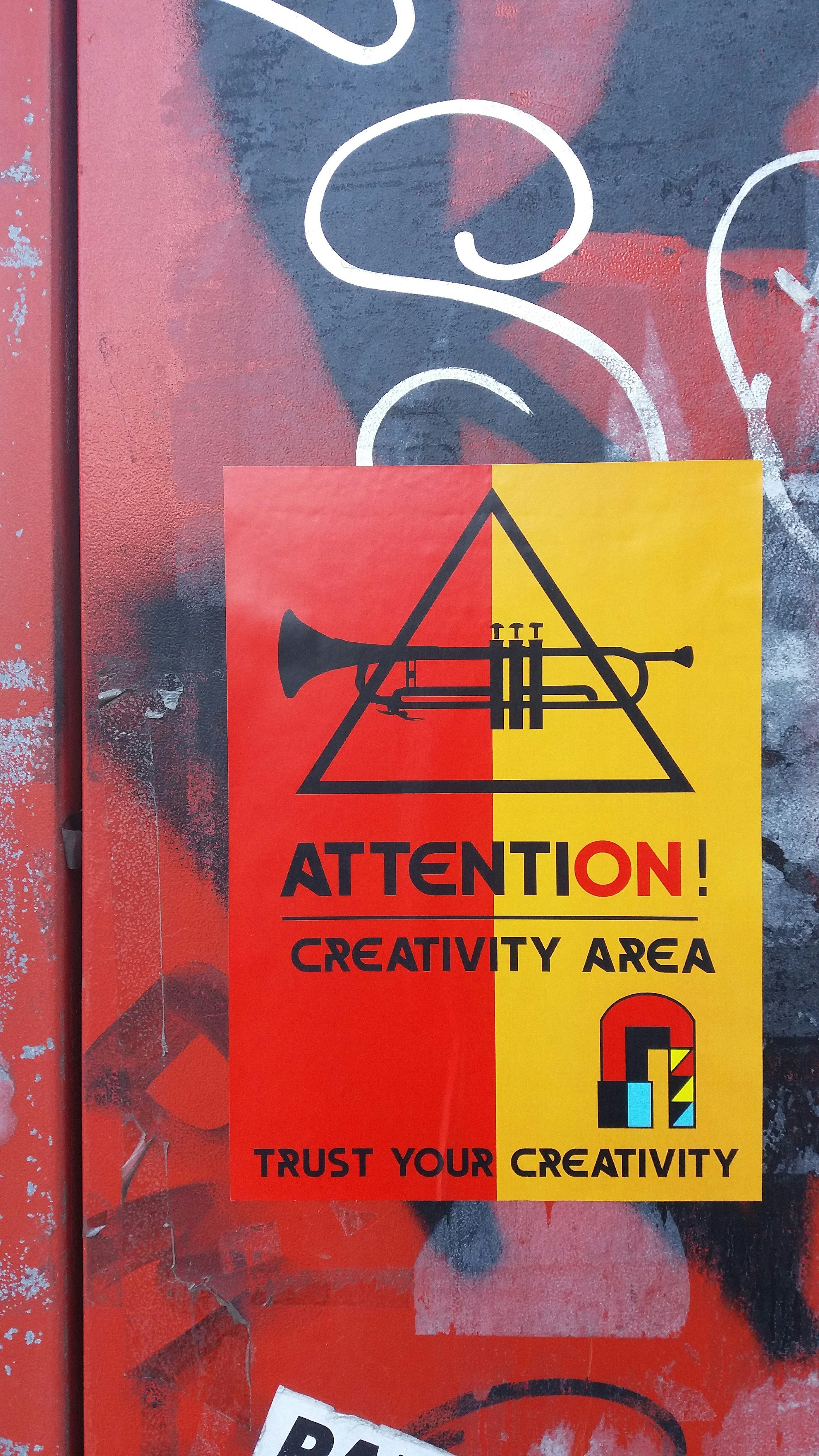 a sign on a door that says attention creativity area trust your creativity